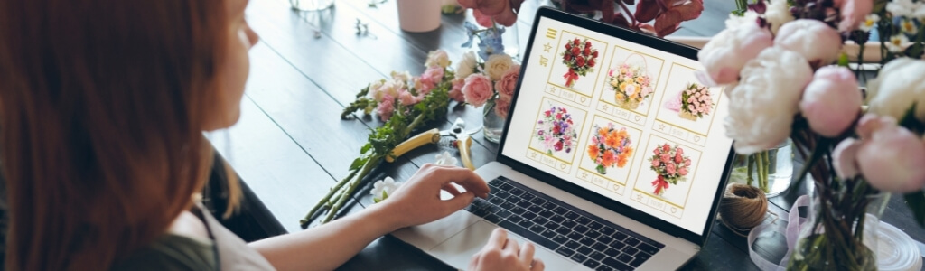 woman looking at her new floral artist website seo research for new websites loudbird marketing