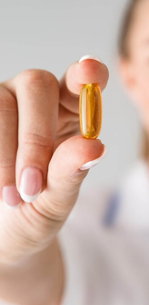 woman holding her vitamin supplement loudbird marketing nutritional supplement marketing services